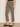 A person wearing Sanctuary Clothing's cadence 90 straight crop jeans in the French Kitty leopard print, paired with black slip-on flat shoes and standing against a neutral background.