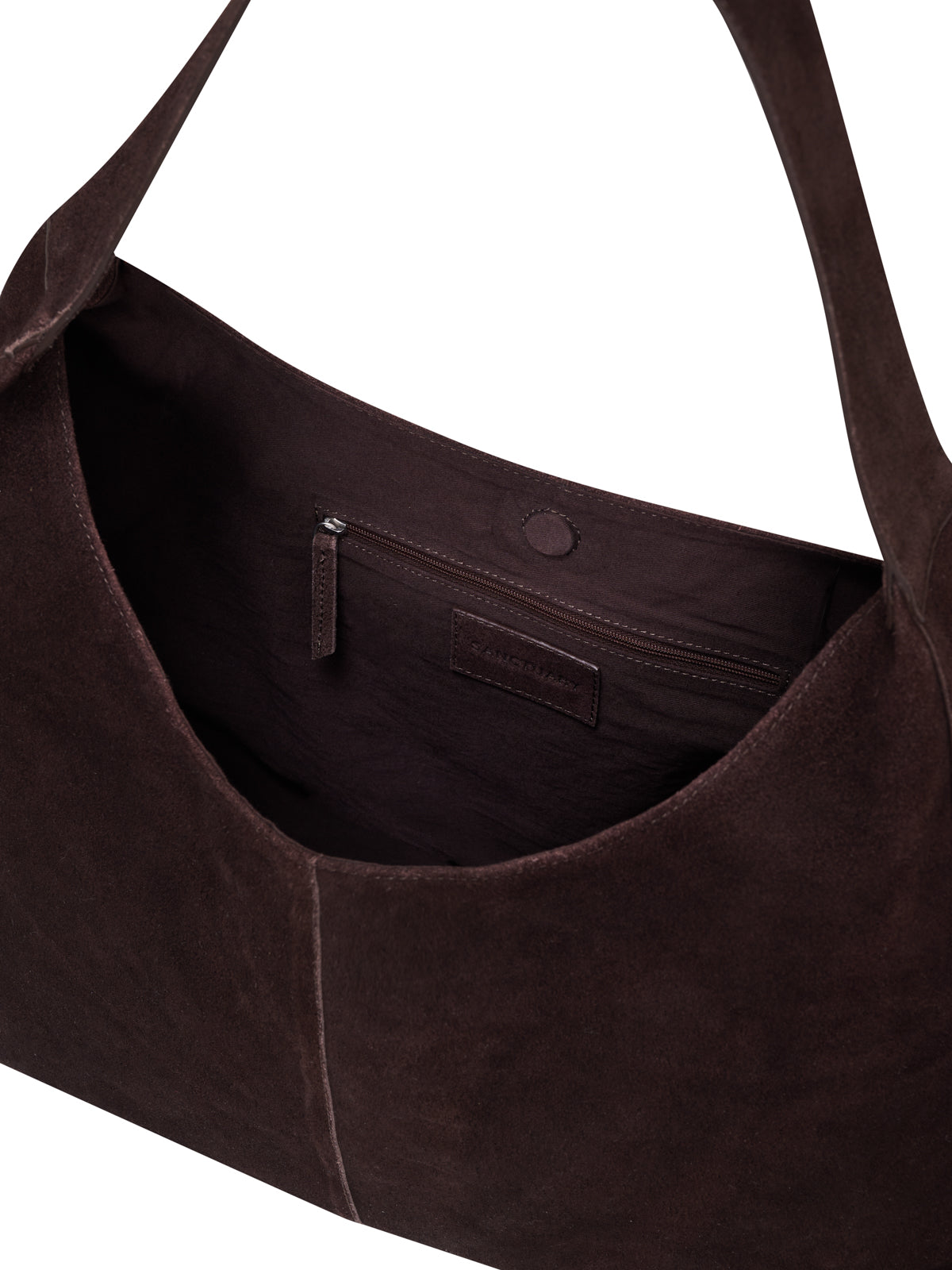 Close-up of the inside of the Sanctuary Clothing endless large hobo bag chicory in dark brown suede, featuring a zippered interior pocket, magnet snap closure at the top, and a single wide shoulder strap.