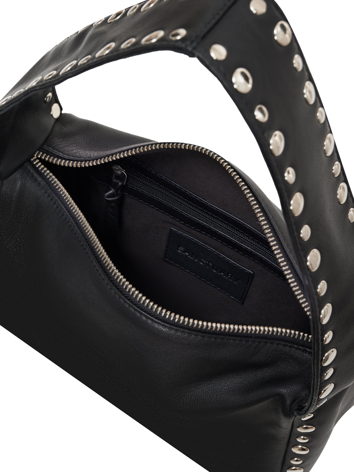 The Sanctuary Clothing midnight bag black is a leather handbag with silver studs on the strap and zipper, an open main compartment, a zippered inner pocket, and a visible black fabric label inside.
