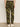 A model faces away to show the back pockets of the Sanctuary Clothing boyfriend utility pant in rambler camo, paired with white sneakers, against a plain background.