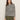 A woman with long brown hair wears the Sanctuary Clothing boatneck long sleeve tee in light oat black stripe, standing against a plain light background.