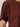 Close-up of a person wearing the Sanctuary Clothing shirred waist dolman tee in chicory. The short sleeves and upper torso are visible against a plain, neutral background.