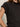 A person wearing the Sanctuary Clothing draped sleeveless mock neck top in black is shown from the upper torso against a plain light background.