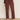 A person, visible from the waist down, stands against a light wall wearing Sanctuary Clothing's cadence 90s straight crop jeans in chicory and leopard print Mary Jane shoes.