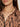 Close-up of a woman wearing the colette shirt mocha leo by Sanctuary Clothing and a gold chain necklace. Only the lower half of her face, neck, and upper chest are visible.