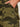Close-up of a hand in the front pocket of Sanctuary Clothing's boyfriend utility pant rambler camo (extended sizing), highlighting detailed stitching and pocket design.