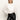 A woman with straight blonde hair models the Sanctuary Clothing new era tuxedo shirt in white, featuring wide cuffs, paired with black leather pants and one hand in her pocket against a plain white background.