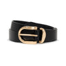 The All Day Belt Black by Sanctuary Clothing features black leather and a shiny gold rounded buckle, coiled neatly on a white background.