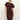 A woman with blonde hair models the Sanctuary Clothing cinched waist t shirt dress in chicory, featuring short sleeves and a midi length, standing against a plain light background with one hand on her hip.