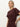 A woman with blonde hair in a low ponytail wears the Sanctuary Clothing cinched waist t shirt dress in chicory. She stands against a light background, one hand on her hip and a neutral expression.