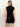 A woman with straight blonde hair is seen from the back, wearing Sanctuary Clothing's "An Affair to Remember" black sequin dress against a plain light background.