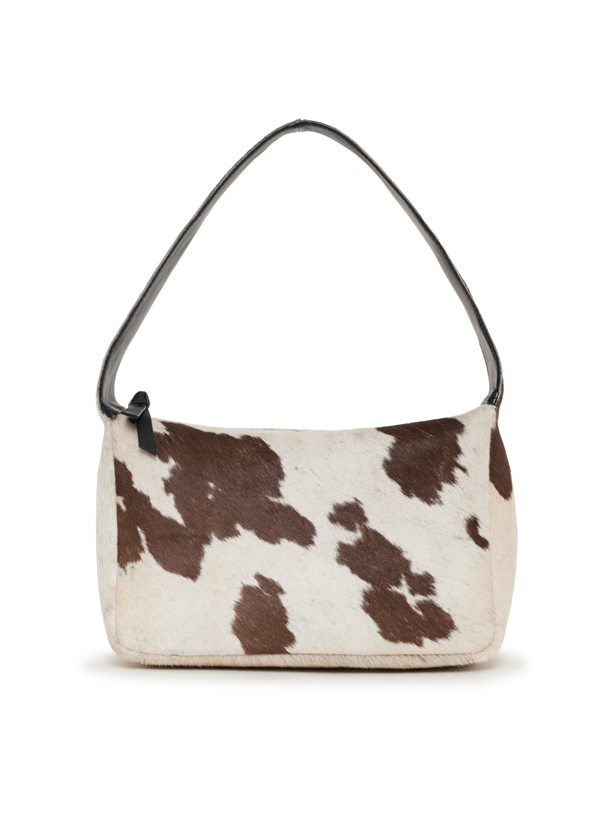 A rectangular shoulder bag with a single strap, covered in white cowhide with irregular brown patches, viewed from the front against a plain white background.