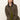 A woman with straight, light brown hair models the Sanctuary Clothing barn jacket in burnt olive over green separates, sitting against a plain background and looking directly at the camera with a neutral expression.