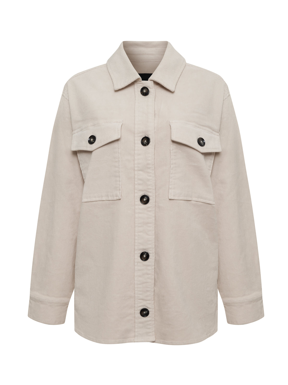 The corduroy shacket mother of pearl by Sanctuary Clothing is a light beige button-up shirt jacket with a collar, long sleeves, two large chest pockets with black button closures, and black buttons down the front.