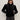 A woman wears Sanctuary Clothing's quilted velvet jacket in black, featuring vertical quilting and puffed sleeves, paired with dark sunglasses and jeans, standing with hands in her pockets against a light background.