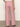 A person faces away from the camera, wearing Sanctuary Clothing's marine full length semi high rise pant galley stripe—red and white striped, wide-leg pants with back pockets—and a white top, standing on a smooth, light-colored floor.