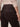 Someone wearing Sanctuary Clothing’s corduroy hayden bootcut pant in semi sweet, featuring back pockets, paired with a light beige sweater; shown from the waist down and viewed from behind.