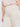 A person wears the Sanctuary Clothing soft marine wide leg crop pant macrame (extended sizing) in cream, featuring visible back pockets, paired with a light pink T-shirt and standing with one arm relaxed by their side.
