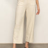 A person stands against a light background wearing the Sanctuary Clothing soft marine wide leg crop pant macrame in cream, featuring front patch pockets and black sandals. Their upper body is mostly out of frame.
