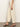 A person models Sanctuary Clothing's soft marine wide leg crop pant macrame, showcased from the side with only the lower body visible, styled with leopard-print heeled sandals against a plain background.