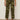 A person models the Sanctuary Clothing rio pant rambler camo cargo pants with black heeled sandals, standing against a beige background with arms relaxed at their sides and upper body not shown.