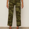 A person models the Sanctuary Clothing rio pant rambler camo cargo pants with black heeled sandals, standing against a beige background with arms relaxed at their sides and upper body not shown.