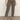 A person wearing Sanctuary Clothing cadence 90 straight crop jeans in french kitty, a white top, and black ankle-strap heels stands on a concrete floor against a plain light background.