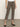 A person wearing Sanctuary Clothing cadence 90 straight crop jeans in french kitty, a white top, and black ankle-strap heels stands on a concrete floor against a plain light background.