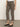 A person wearing Sanctuary Clothing's cadence 90 straight crop jeans in French Kitty, styled with a white top and black low-heeled Mary Jane shoes, stands on a gray concrete floor against a plain background.
