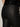 Close-up of a person wearing Sanctuary Clothing's slick brook bootcut pant in black, featuring visible back pocket stitching and a "SANCTUARY" label above the pocket; part of a black sequin top is also shown.