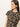 A woman with long brown hair wears the Sanctuary Clothing double knit perfect tee winter leopard, standing against a light background and looking to the right.