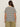 A person with long brown hair wears Sanctuary Clothing's notch neck tee in light oat black stripe, paired with olive green pants, standing against a plain light background.