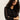 A woman with curly hair models the Sanctuary Clothing fitted mesh button down top in black, standing against a light neutral background with her arms crossed and head slightly tilted as she looks at the camera.