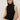 A woman with straight brown hair models the Sanctuary Clothing ribbed funnel neck top in black, paired with light blue jeans. She stands against a plain background with her hands in her pockets, looking directly at the camera.