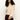 A woman with curly hair models the Sanctuary Clothing Forever Cashmere Popover in toasted beige, featuring wide sleeves, paired with burgundy pants against a plain white background. She faces forward with one arm slightly extended.