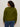 Seen from the back, a person with curly dark hair wears the Sanctuary Clothing must have cardi in martini olive and blue jeans against a neutral background.
