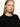 A person with long, straight blonde hair and fair skin models the must have cardi black by Sanctuary Clothing, buttoned up and worn confidently in front of a plain white background.