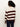 A person faces away, wearing Sanctuary Clothing’s 24 7 Popover in chicory light oat—a cream and brown striped sweater—paired with dark blue jeans, set against a plain light backdrop.