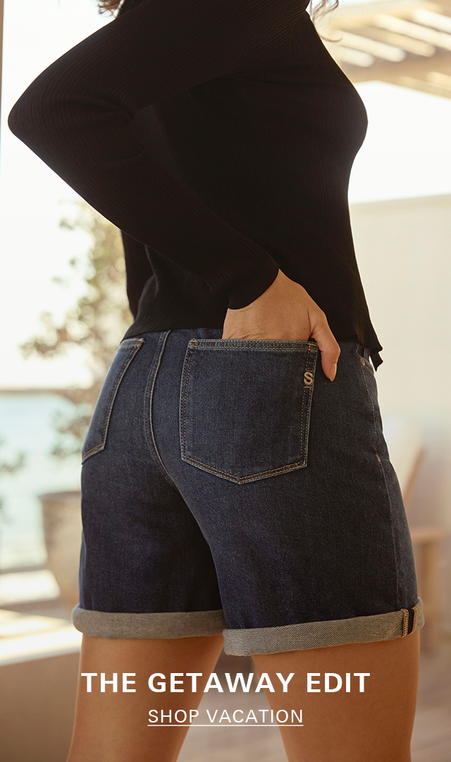 Woman in denim shorts. Shop the Vacation Edit