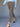 A person wearing Sanctuary Clothing cadence 90 straight crop jeans in french kitty leopard print, paired with a light blue sweater and black pointed-toe heels, walks against a plain background. Only the lower half is visible.