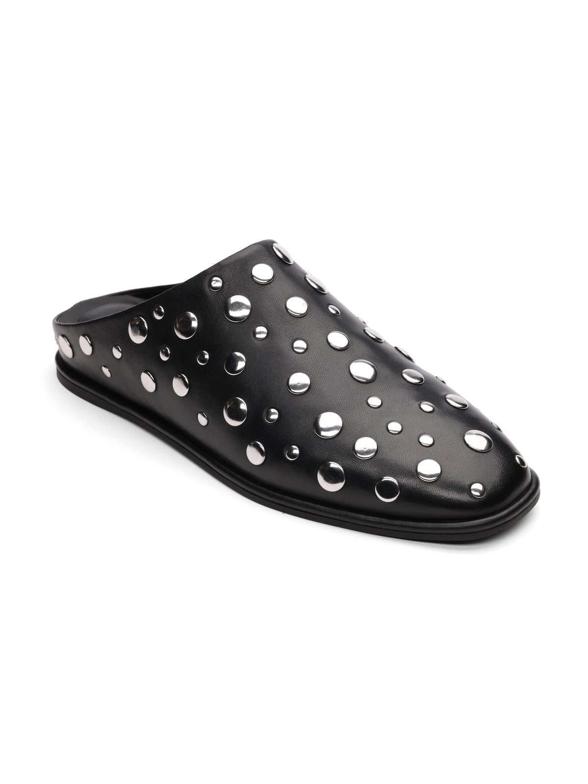 The Sanctuary Clothing bari studs mule black is a slip-on shoe featuring a flat sole and an upper adorned with shiny silver metallic studs in various sizes.